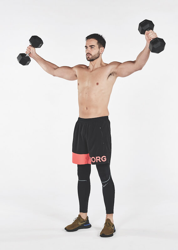 Topless man performing scaption exercise with dumbbells, one of the best workout finishers