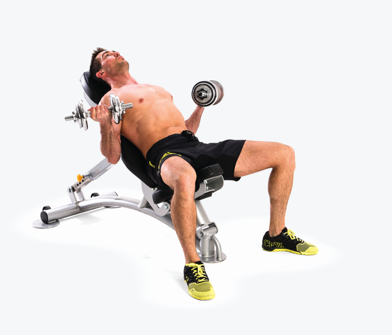 man demonstrated seated curl; sitting on a bench, he lifts and lowers two dumbbells in either hand