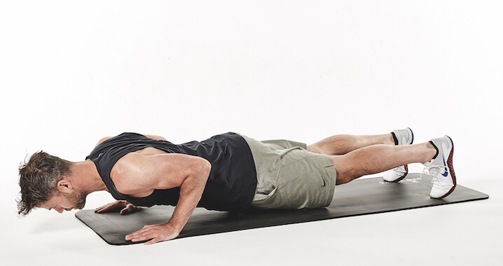 man demonstrates t press up in 30-minute fat loss workout