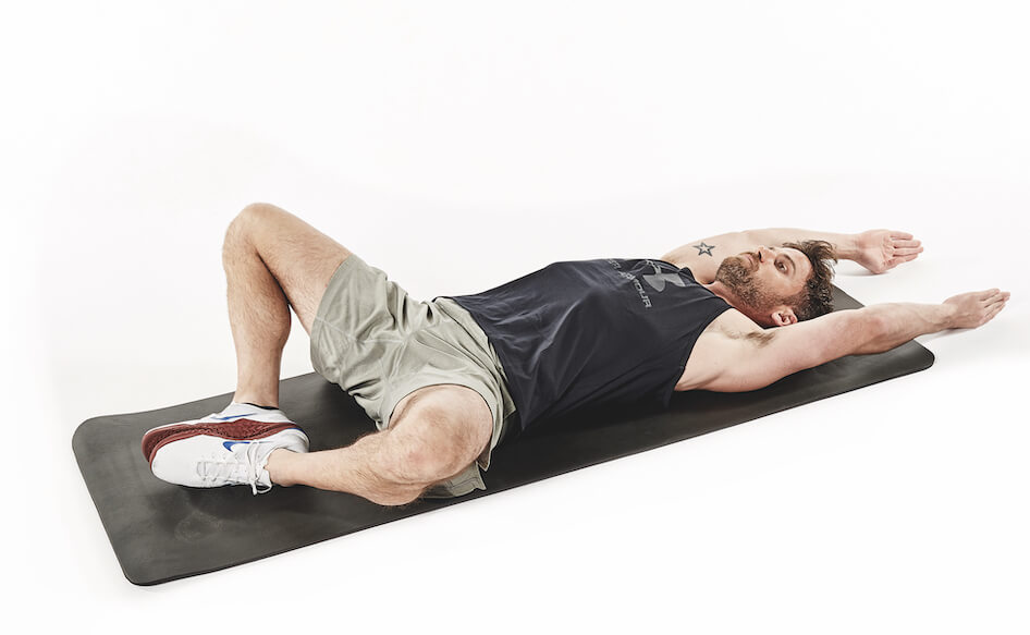 man demonstrates butterfly sit up in 30-minute fat loss workout