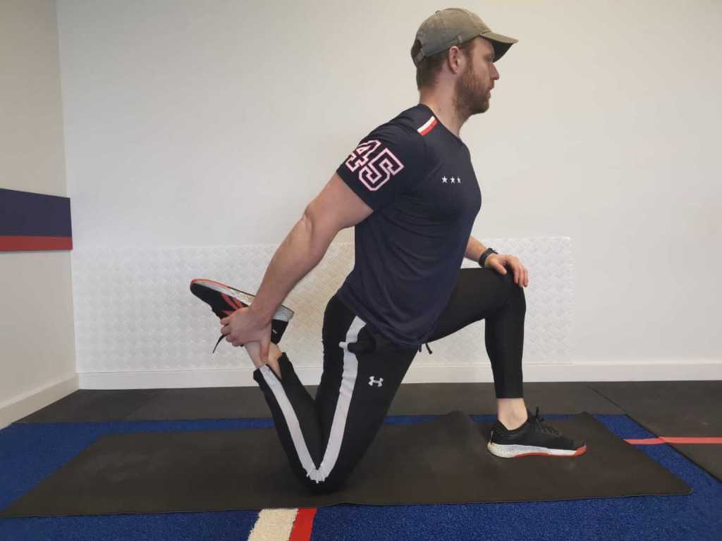 Man performing a kneeling lunge