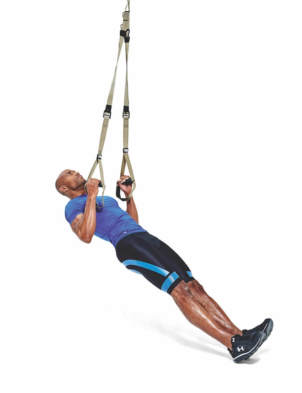 man performing TRX row as part of a workout for cyclists