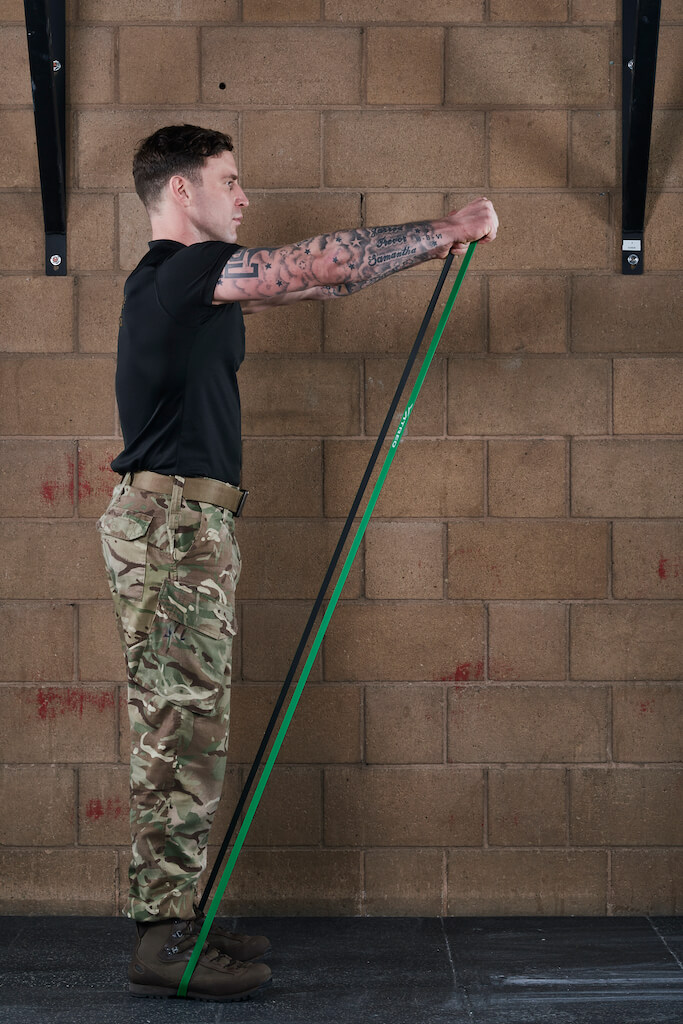 Man demonstrating a Resistance Band Front Raise