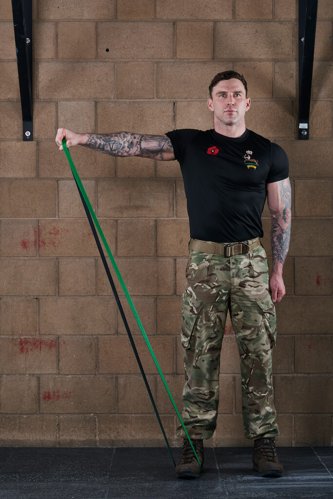 Man demonstrating a Resistance Band Side Raise
