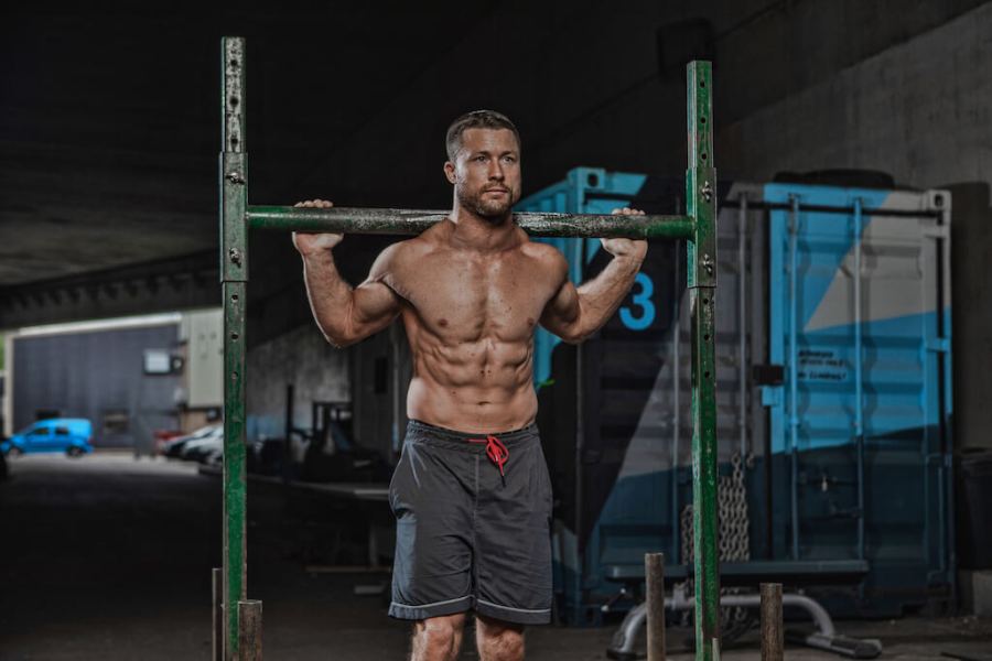 man performing strongman exercise