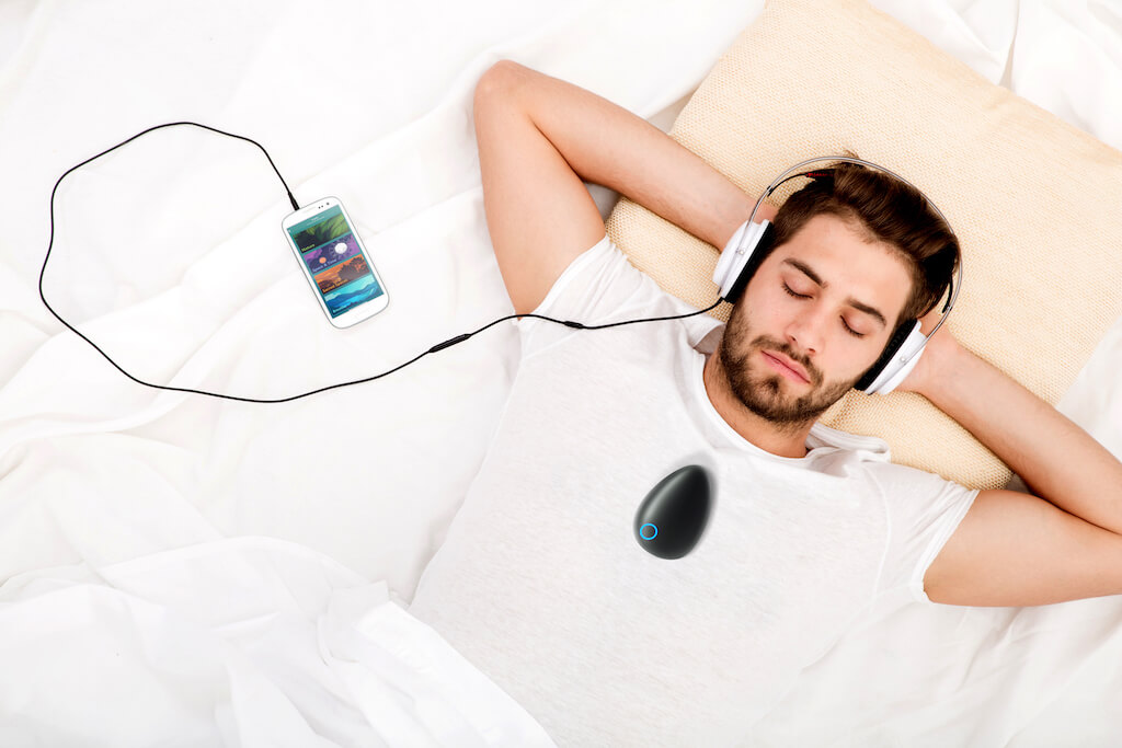Man relaxing with Sensate device