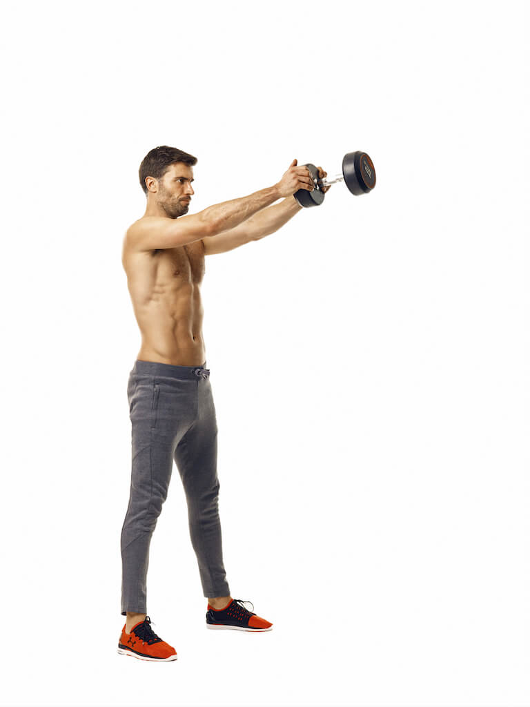 A man performing a dumbbell swing