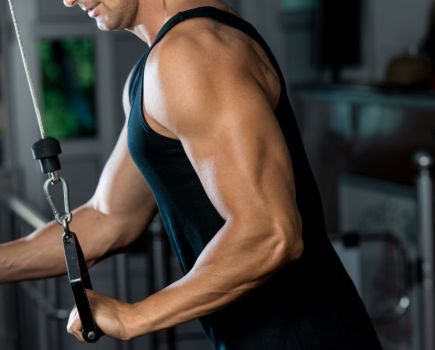 man working out in the gym to get bigger triceps fast