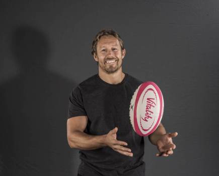 Jonny Wilkinson holding rugby ball and smiling for interview with Men's Fitness