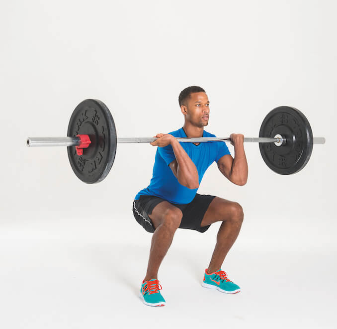 man performing barbell front squat