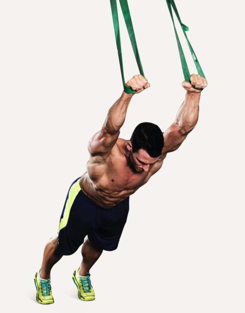 Man performing a standing band fall-through - best abs exercises