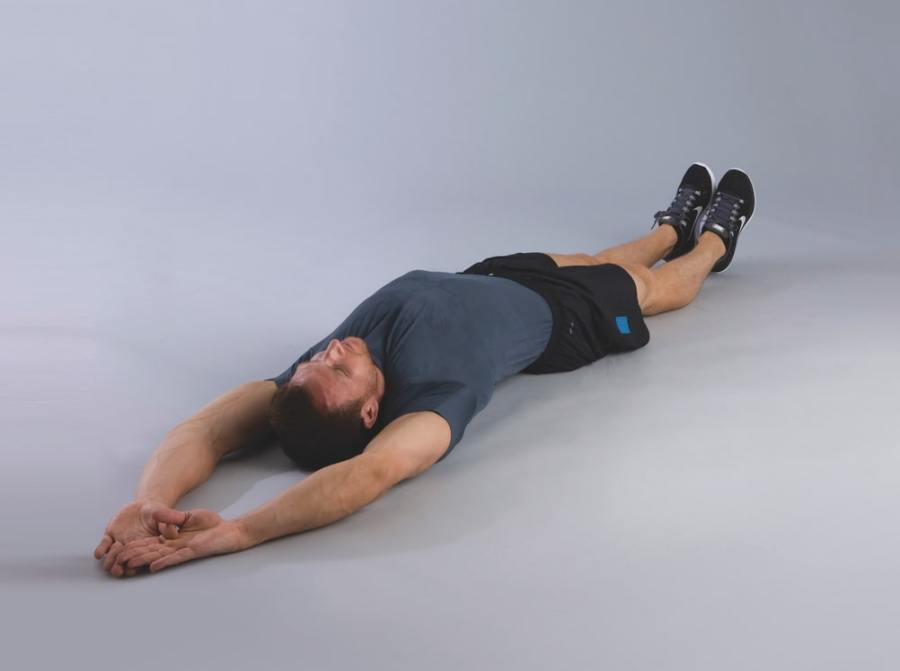 man performing v-up abs exercise