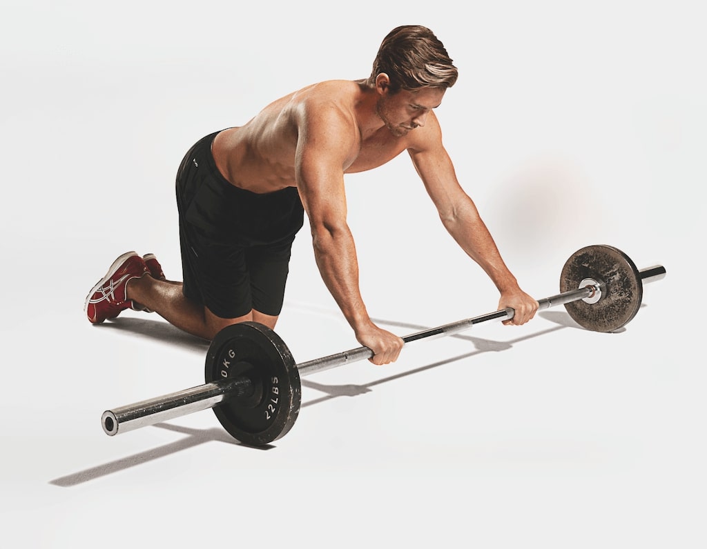 man demonstrating barbell rollout 
