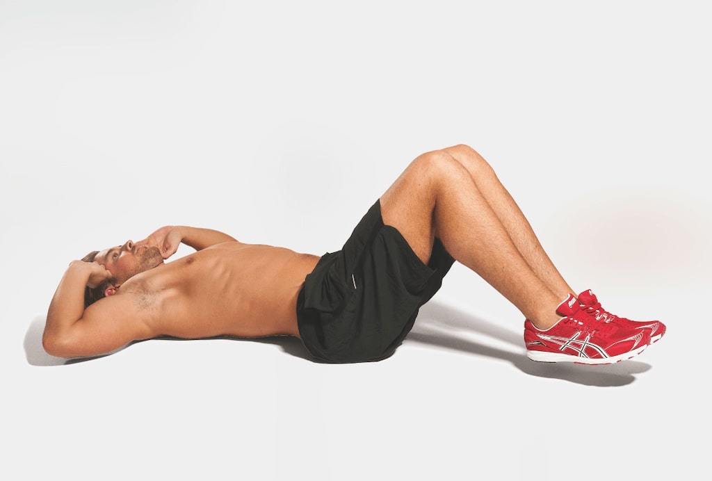 man demonstrating reverse crunch best abs exercises