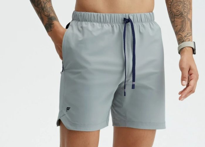 A man's lower body wearing Fabletics The One 7-Inch Shorts