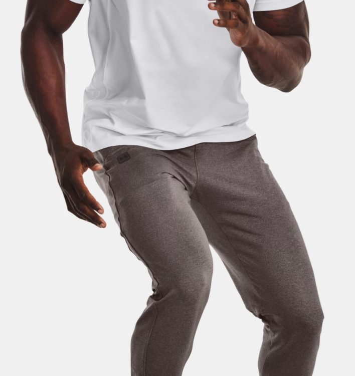 A man wearing Under Armour Meridian Tapered Pants