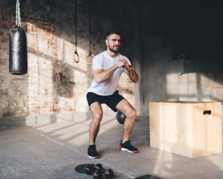 Man using bodyweight exercises in gym
