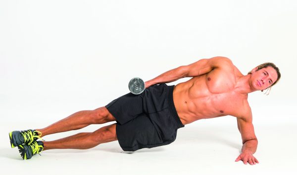 Man performing side plank with lateral raise in dumbbell abs workout