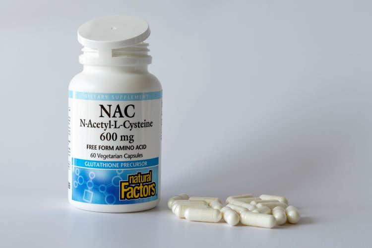 An open bottle of NAC tablets
