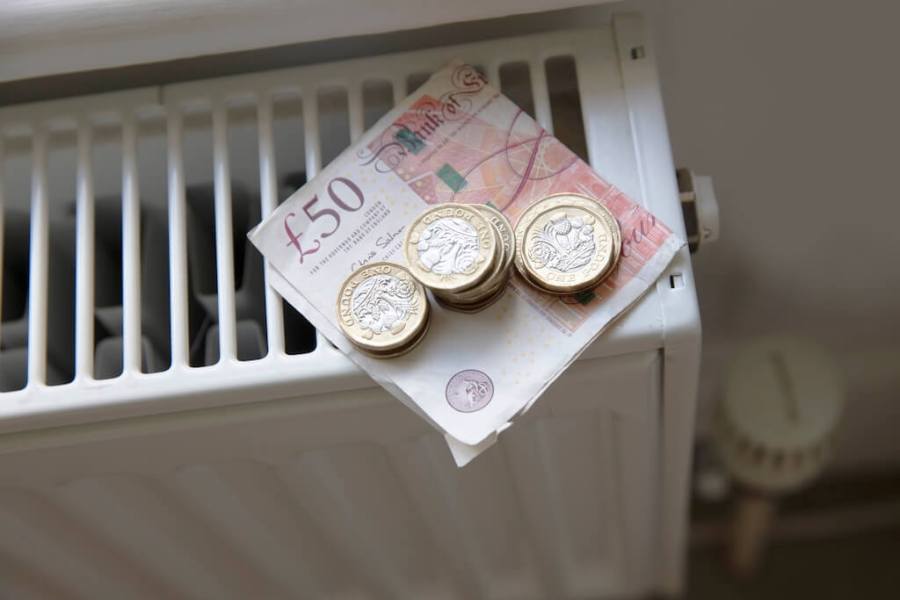radiator with money on it to demonstrate cost of living crisis