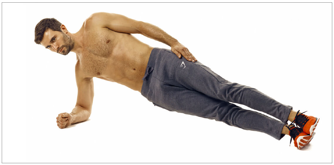 man performing side plank abs exercise in 6 week fat loss plan