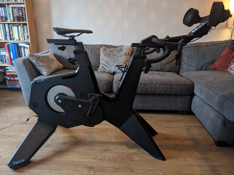 A Garmin TACX Neo Bike Plus set up in a living room