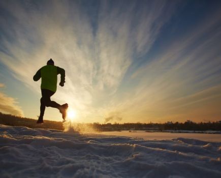 Man running in winter countryside