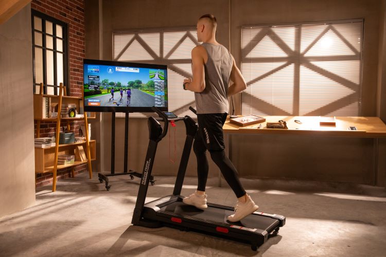 A man exercising at home on the Mobvoi Home Treadmill Incline