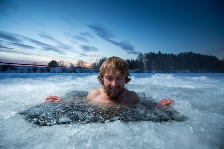 Man plunging into hole in frozen lake