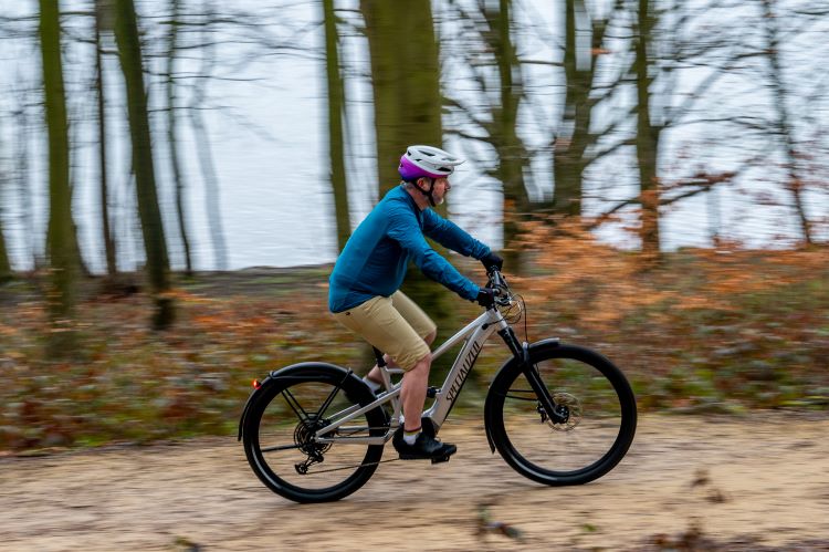 A man riding the Specialized Turbo Tero X on a woodland trail