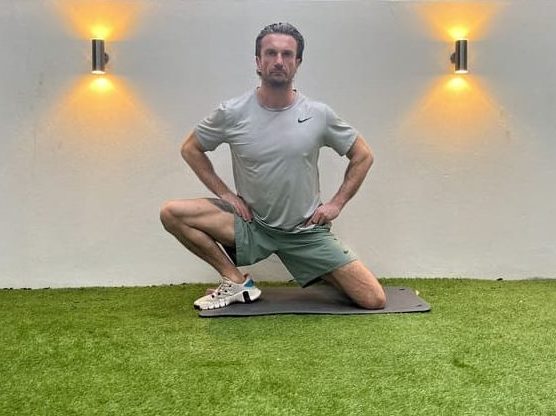 man demonstrates adductor dip stretches