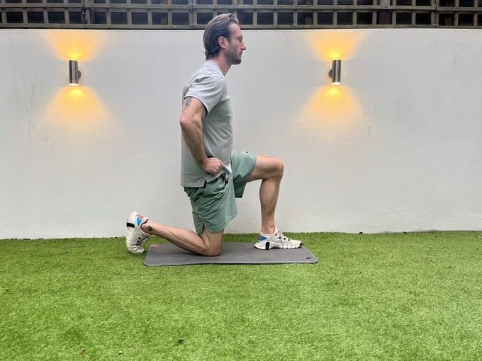man demonstrates half kneel hip flexor stretch