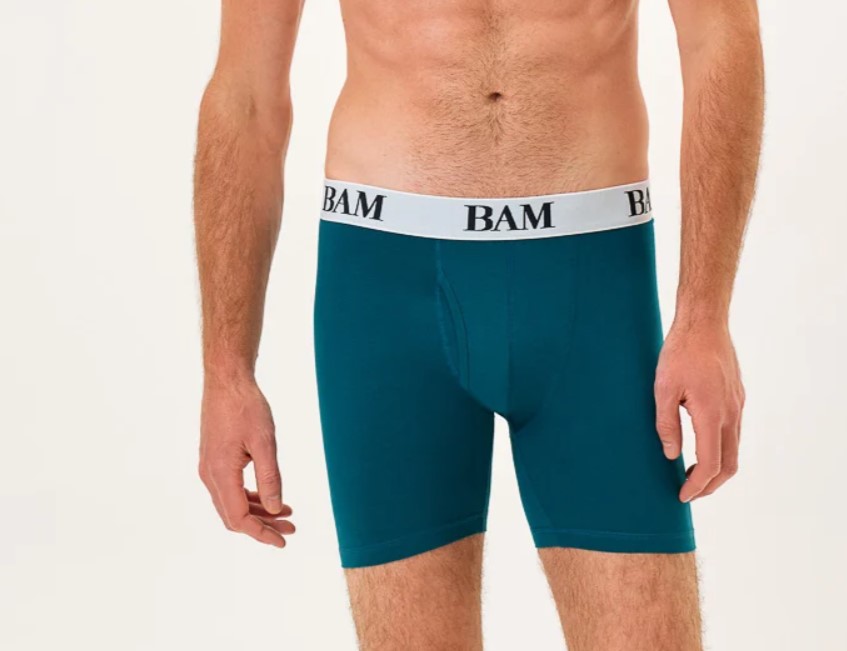 Mid-torso shot of a man wearing BAM sports trunks, some of the best moisture-wicking underwear