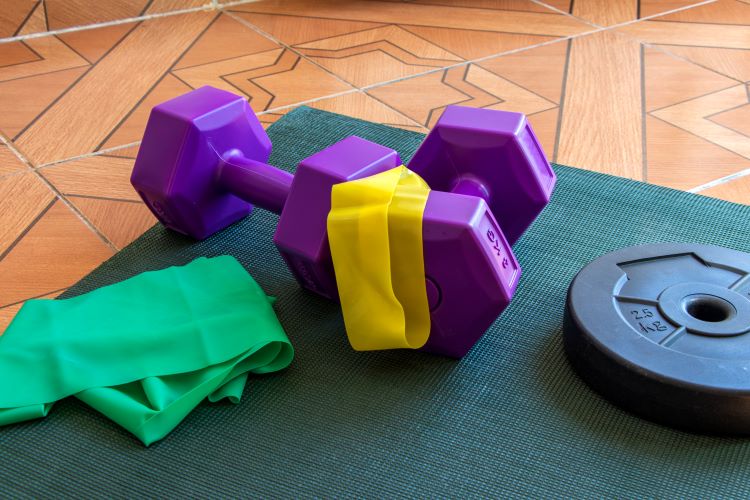 Weights and bands on an exercise mat
