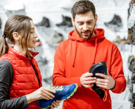 Man getting advice about running shoes