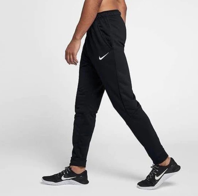 Lower torso of a man wearing Nike joggers