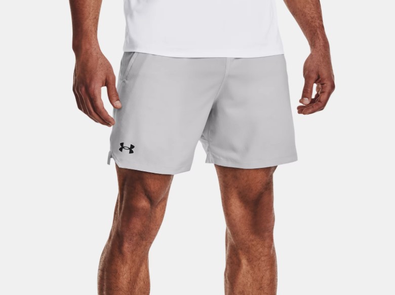 Product shot of a man wearing grey Under Armour Woven Vanish shorts