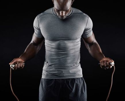 Close up of a man working out with a skipping rope