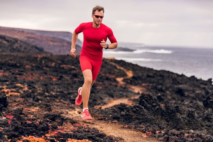 A trail runner wearing compression clothing