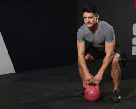 Man performing a barbell squat