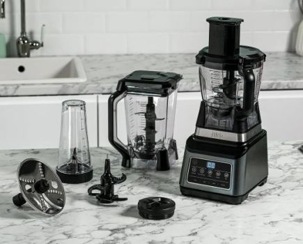 Ninja blender and accessories on a kitchen tabletop