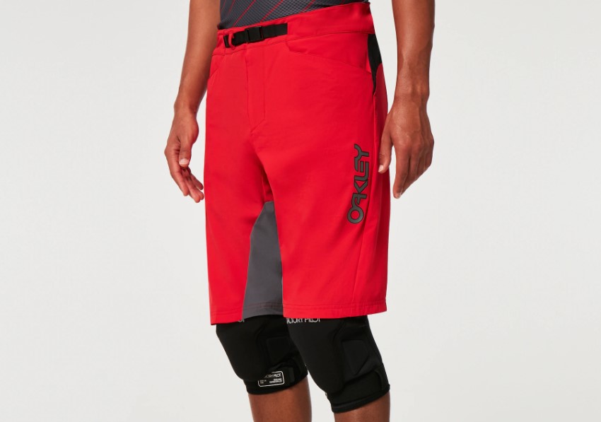 Product shot mid torso of a man wearing Oakley mtb shorts