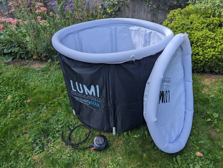 A portable ice bath set up in a garden