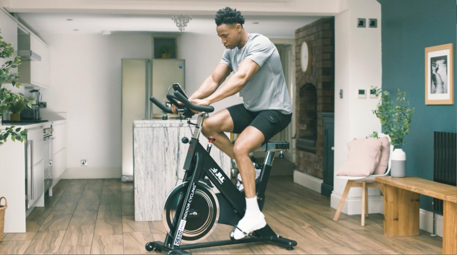 Man riding indoor exercise bike