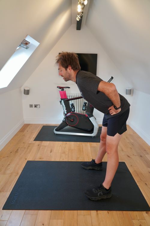 Man in home gym performing hip exercises One of the best strength exercises for cyclists