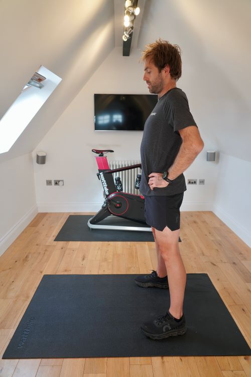 Man in home gym performing hip exercises