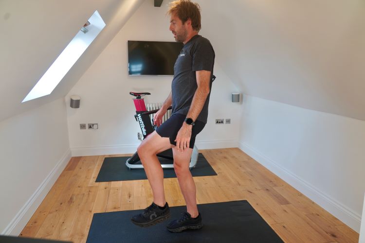 Man performing stretches in home gym