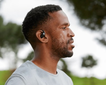 Close up of a man exercising with earphones