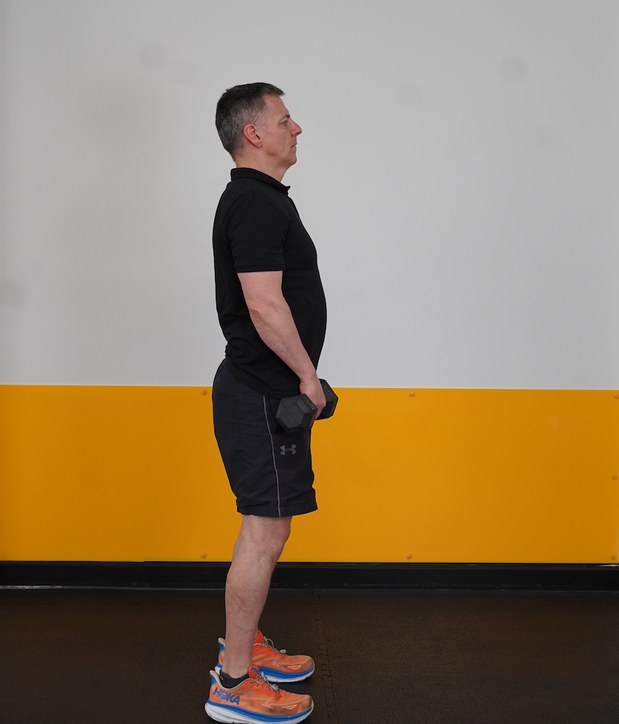 man performing dumbbell deadlift to show how to strength train in your sixties