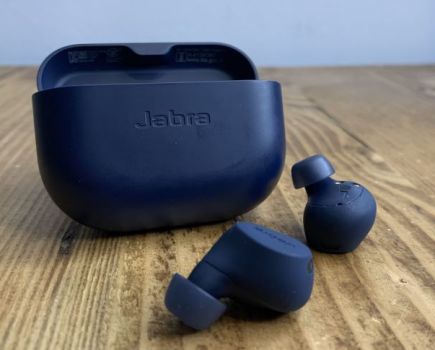 A pair of Jabra sports headphones and case on a table